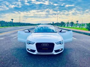 Audi A5 white luxury coupe available for rent at Fast Motors Rent a Car – sleek and stylish vehicle ideal for executive travel, events, and long-distance comfort rides.